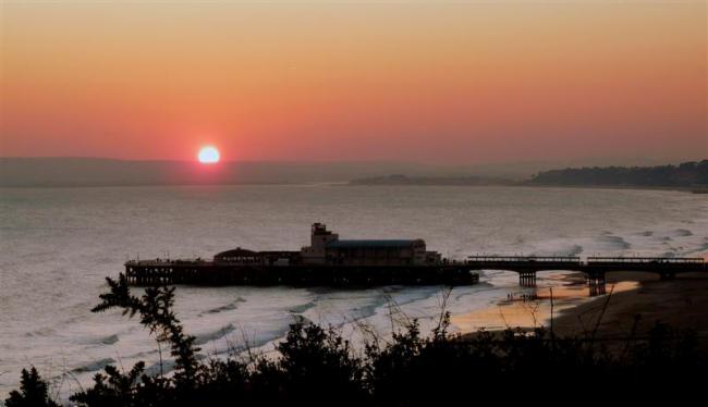 Sunset over the Purbecks, with Bournemouth Pier in foreground.