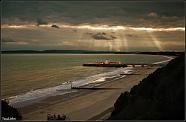 I took this photo on a cliff overlooking the coast and the Pier at Bournemouth. 
I feel I was blessed with the view of shafts of lights through the...