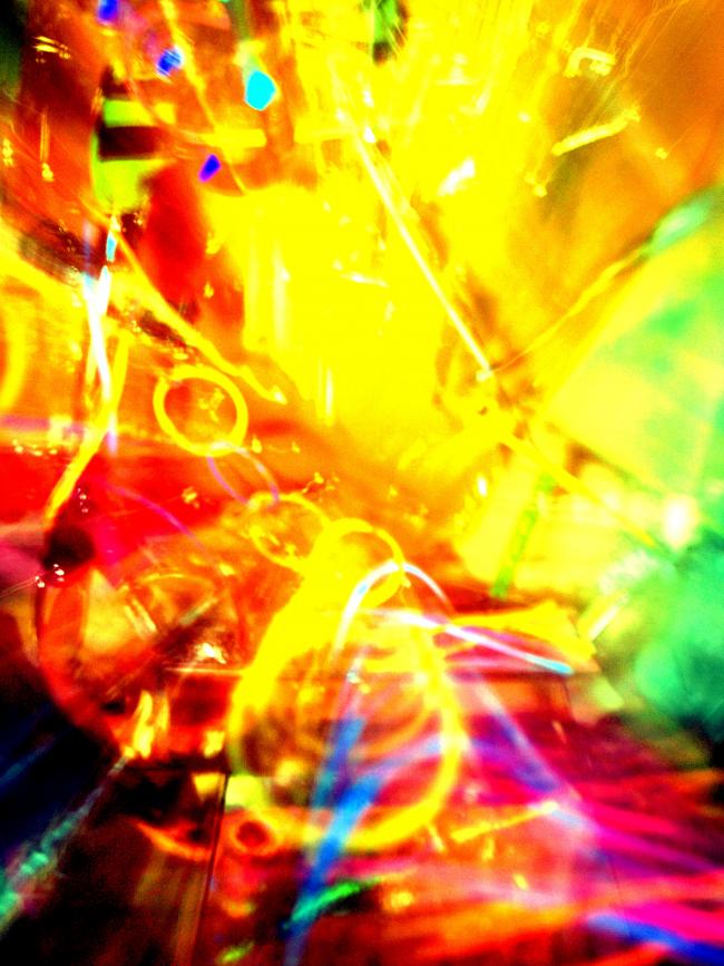 Image of a sculpture i made out of random bits and glow sticks. I then zoomed out as i took the exposure on a long shutter speed to add movement, i then edited the colour curves in photoshop
